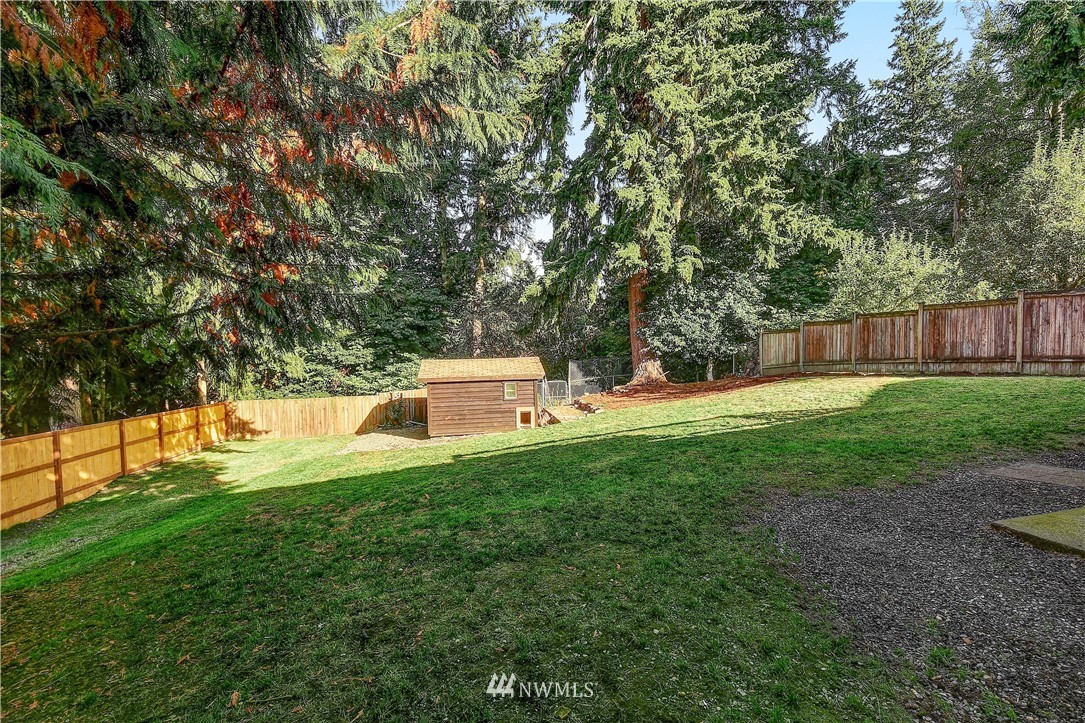 22119 Meridian Avenue South Bothell, WA 98021 - Photo 4 of 17 a garden with wooden fence