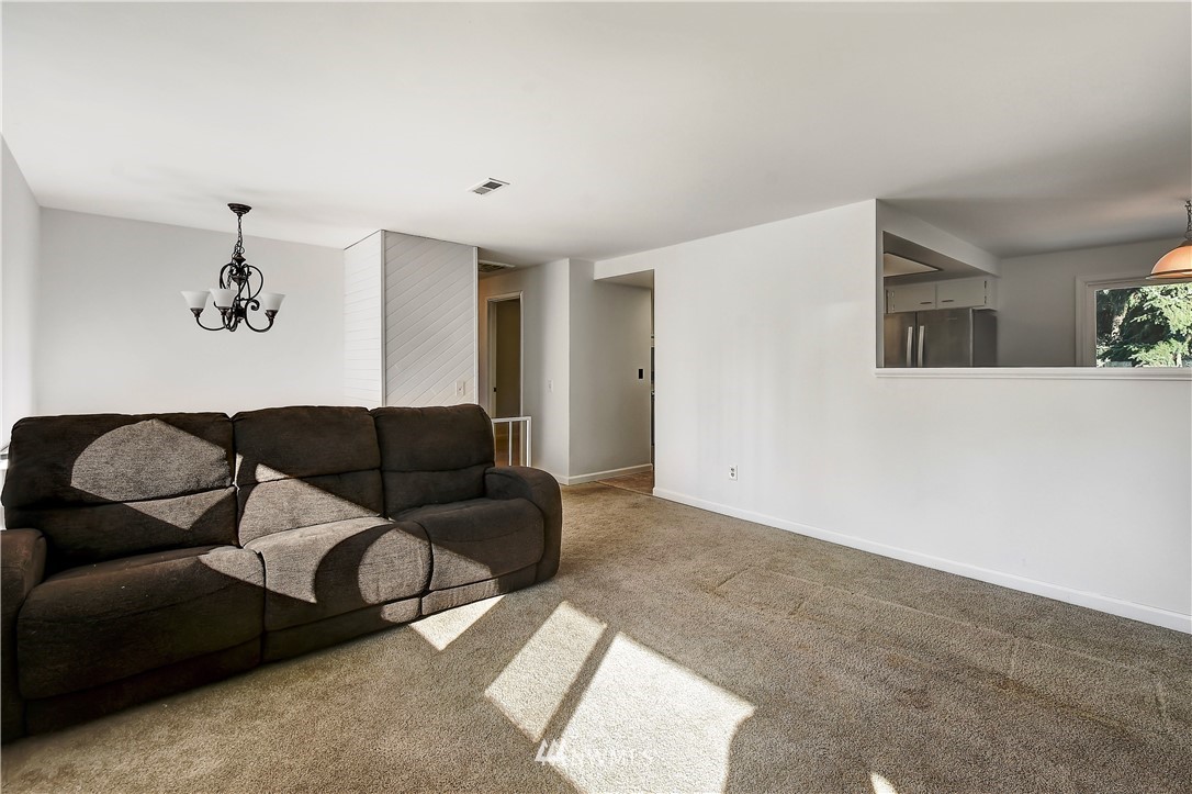 22119 Meridian Avenue South Bothell, WA 98021 - Photo 8 of 17 a living room with furniture and a couch
