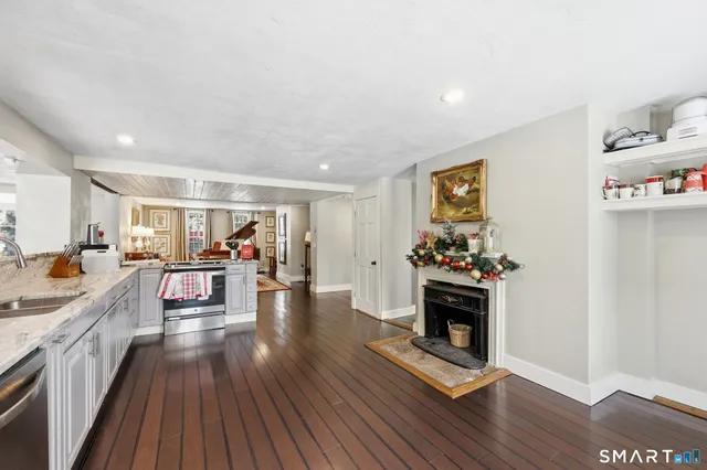 a bath room with a table and a potted plant