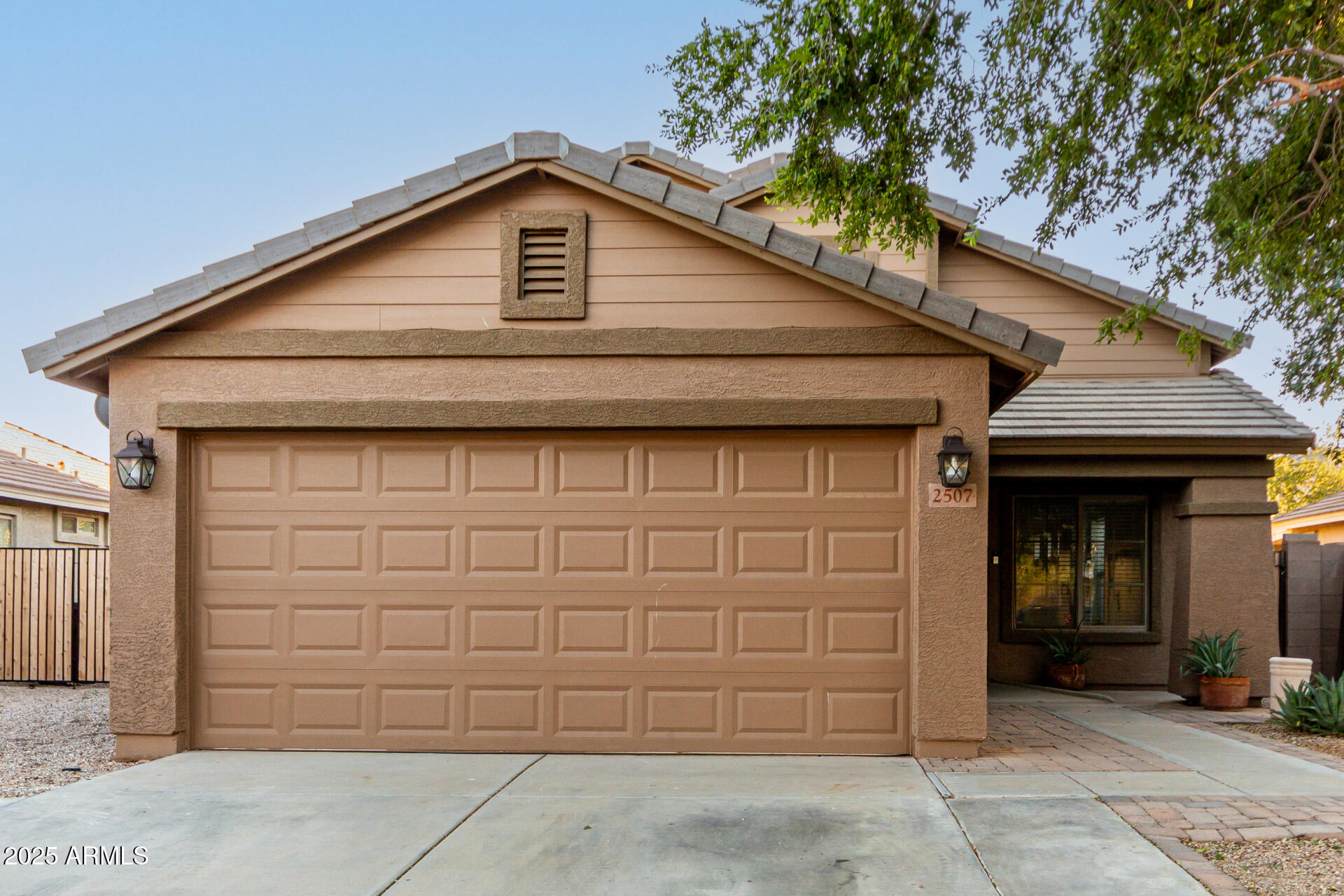 a front view of a house with a garage