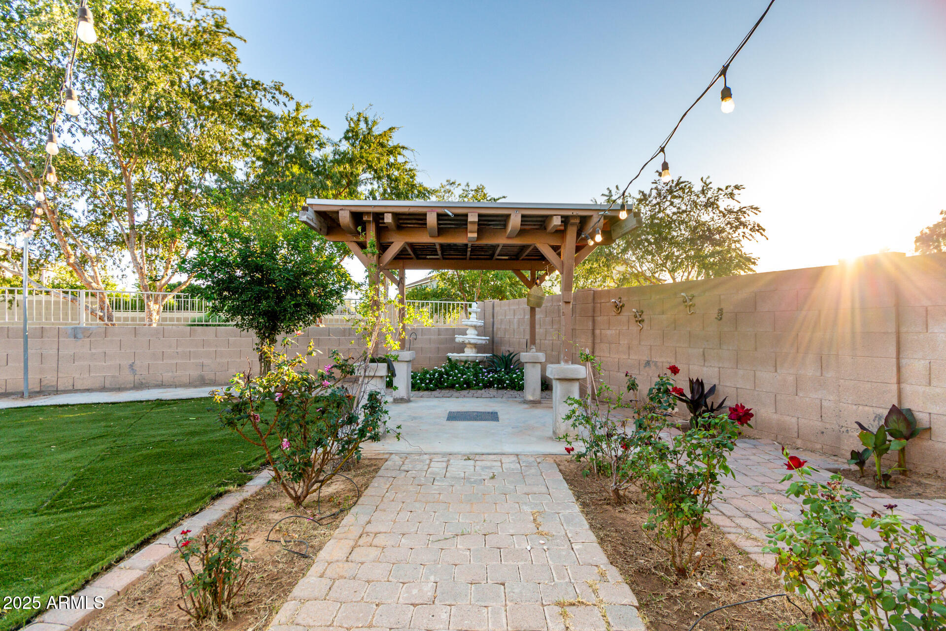 2507 West Desert Spring Way San Tan Valley, AZ 85144 - Photo 19 of 24 a view of a pathway with flower plants