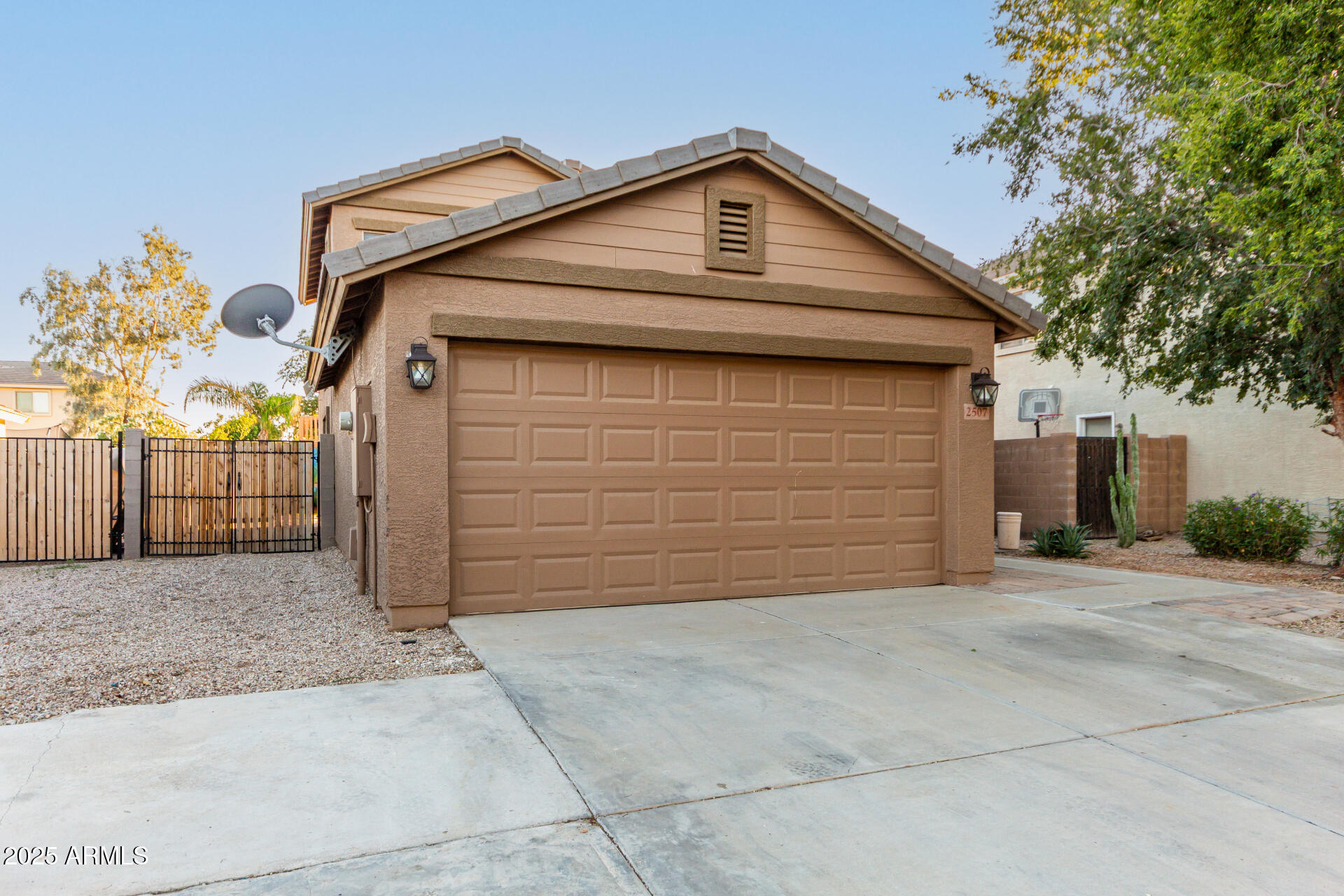2507 West Desert Spring Way San Tan Valley, AZ 85144 - Photo 24 of 24 a front view of a house with a garage