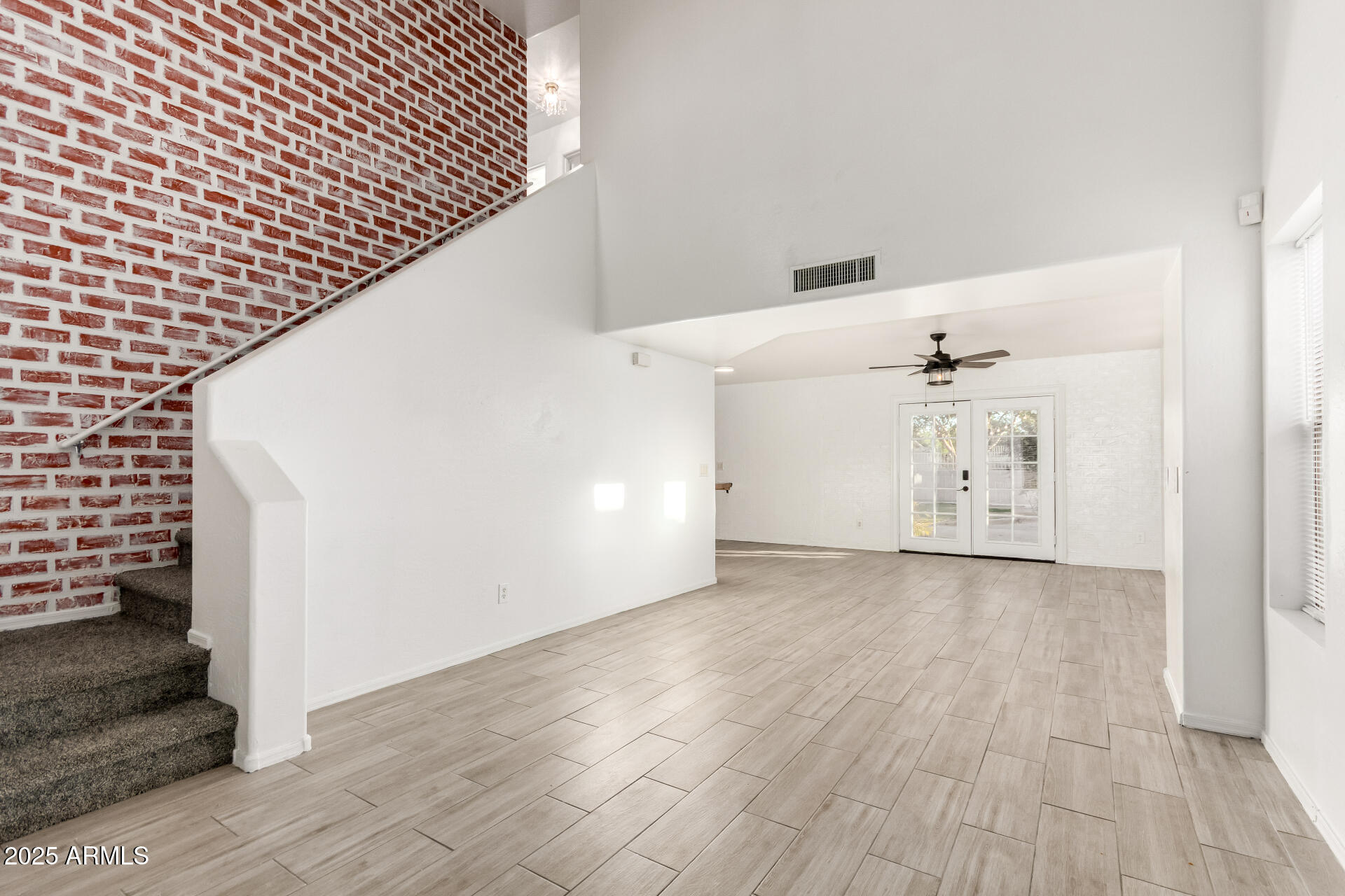 2507 West Desert Spring Way San Tan Valley, AZ 85144 - Photo 4 of 24 a view of a hallway with wooden floor