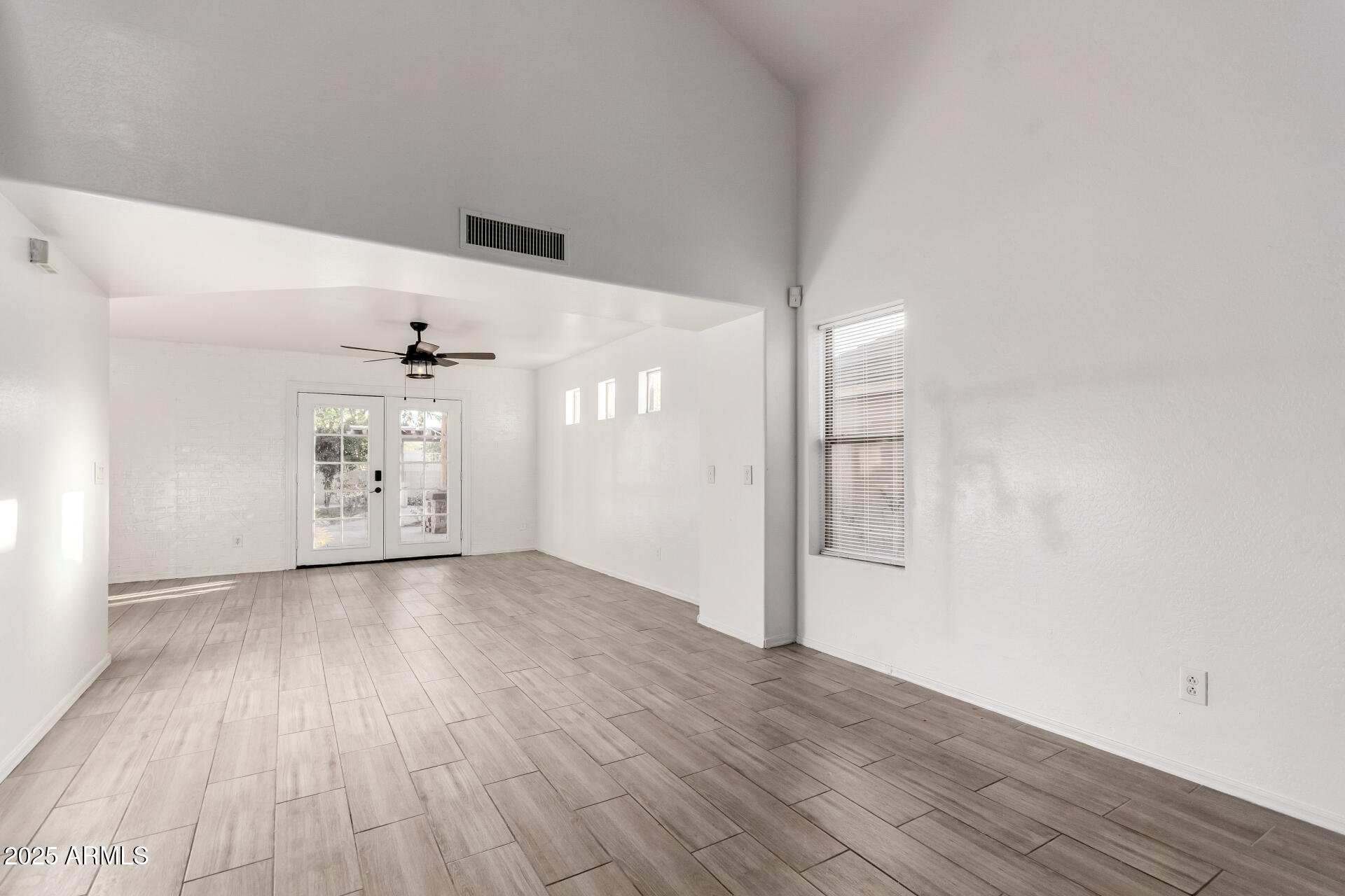 2507 West Desert Spring Way San Tan Valley, AZ 85144 - Photo 5 of 24 wooden floor in an empty room