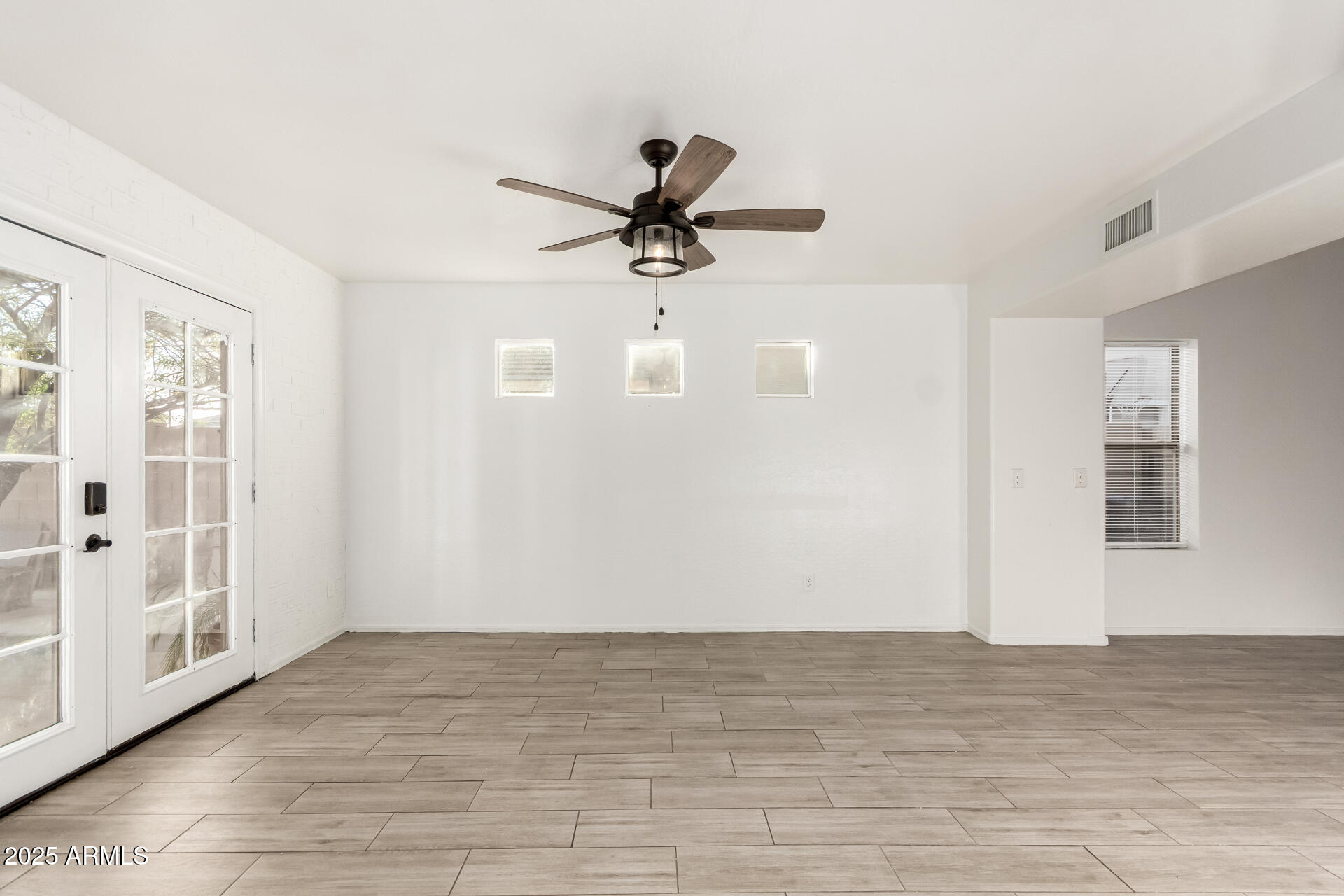 2507 West Desert Spring Way San Tan Valley, AZ 85144 - Photo 9 of 24 a view of a livingroom with a ceiling fan