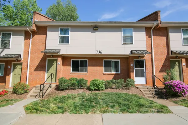 front view of a house with a yard