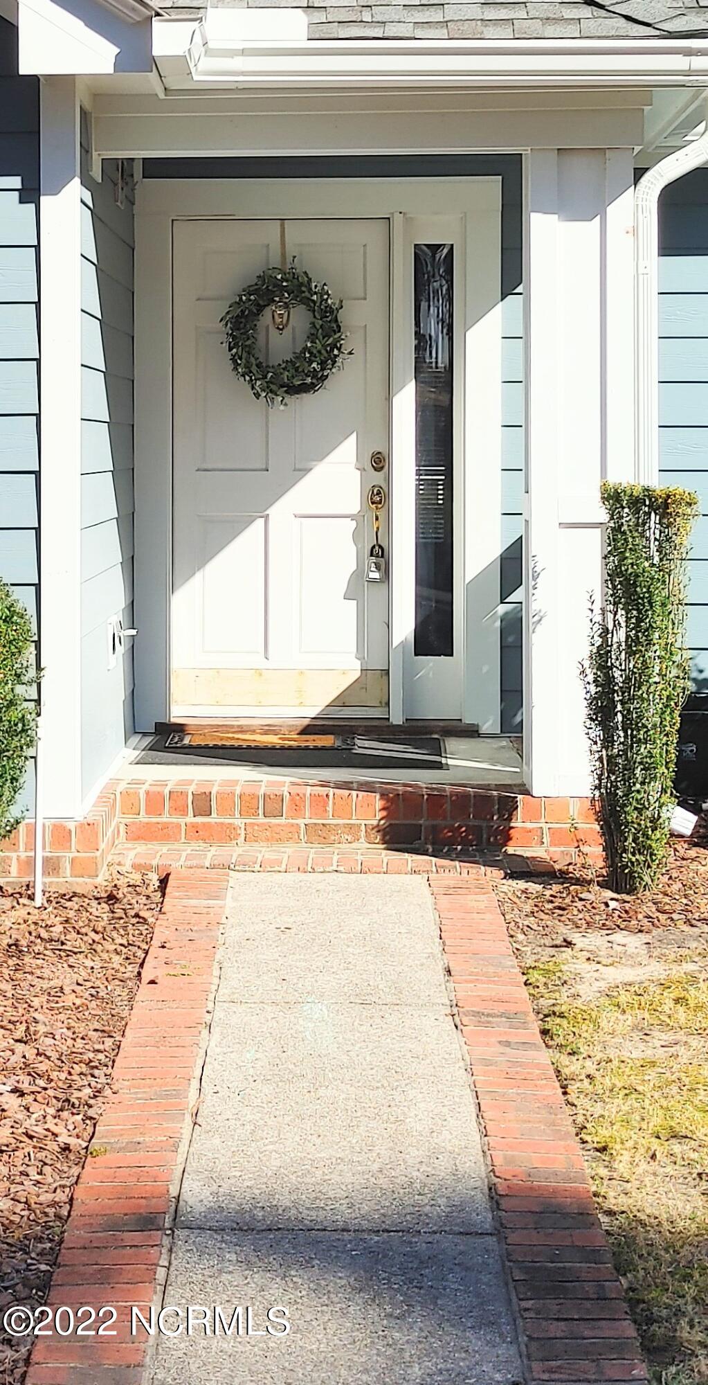 245 Knoll Road Southern Pines, NC 28387 - Photo 2 of 18 Walkway to covered front porch