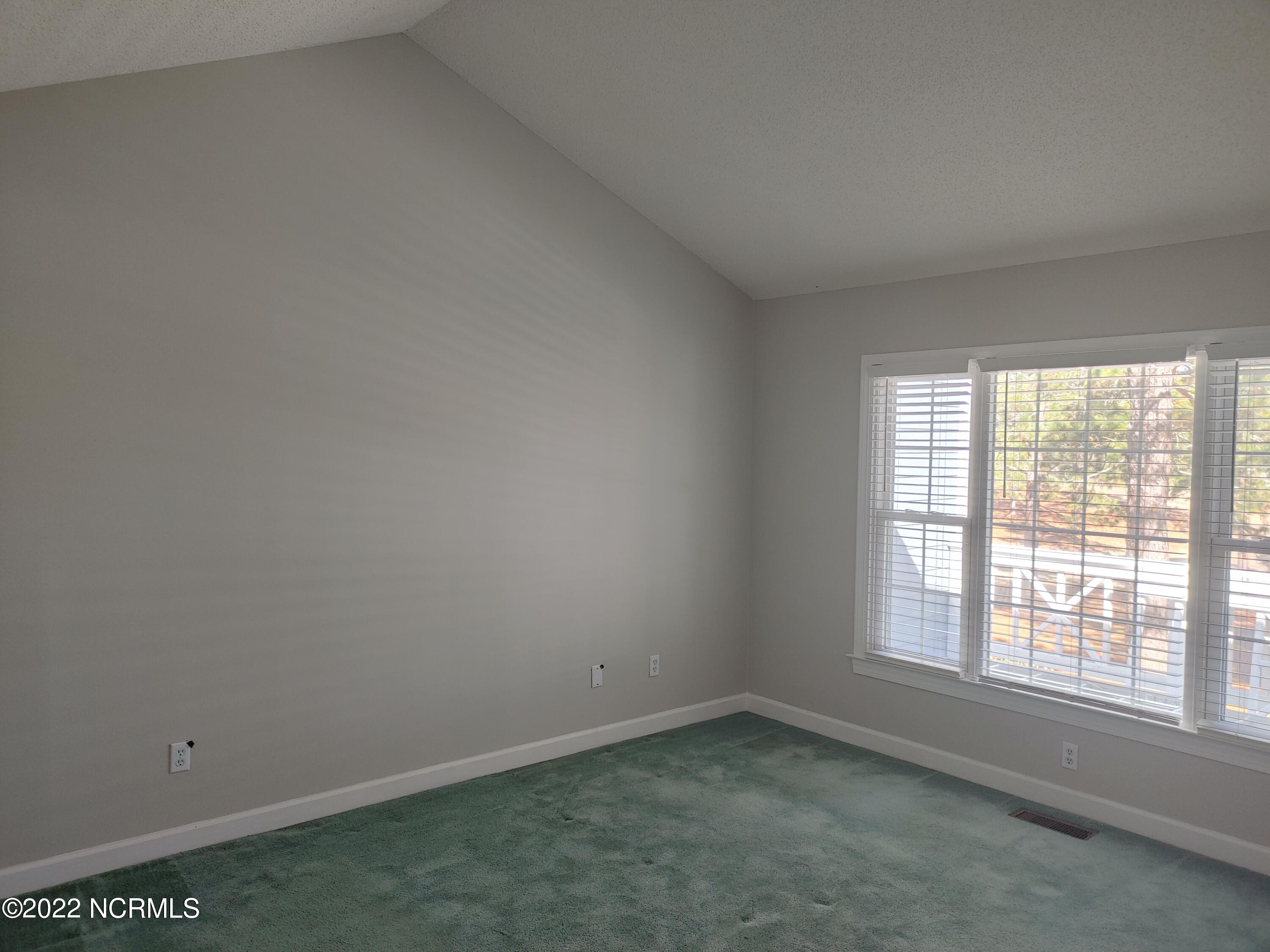 245 Knoll Road Southern Pines, NC 28387 - Photo 8 of 18 master bedroom with vaulted ceiling