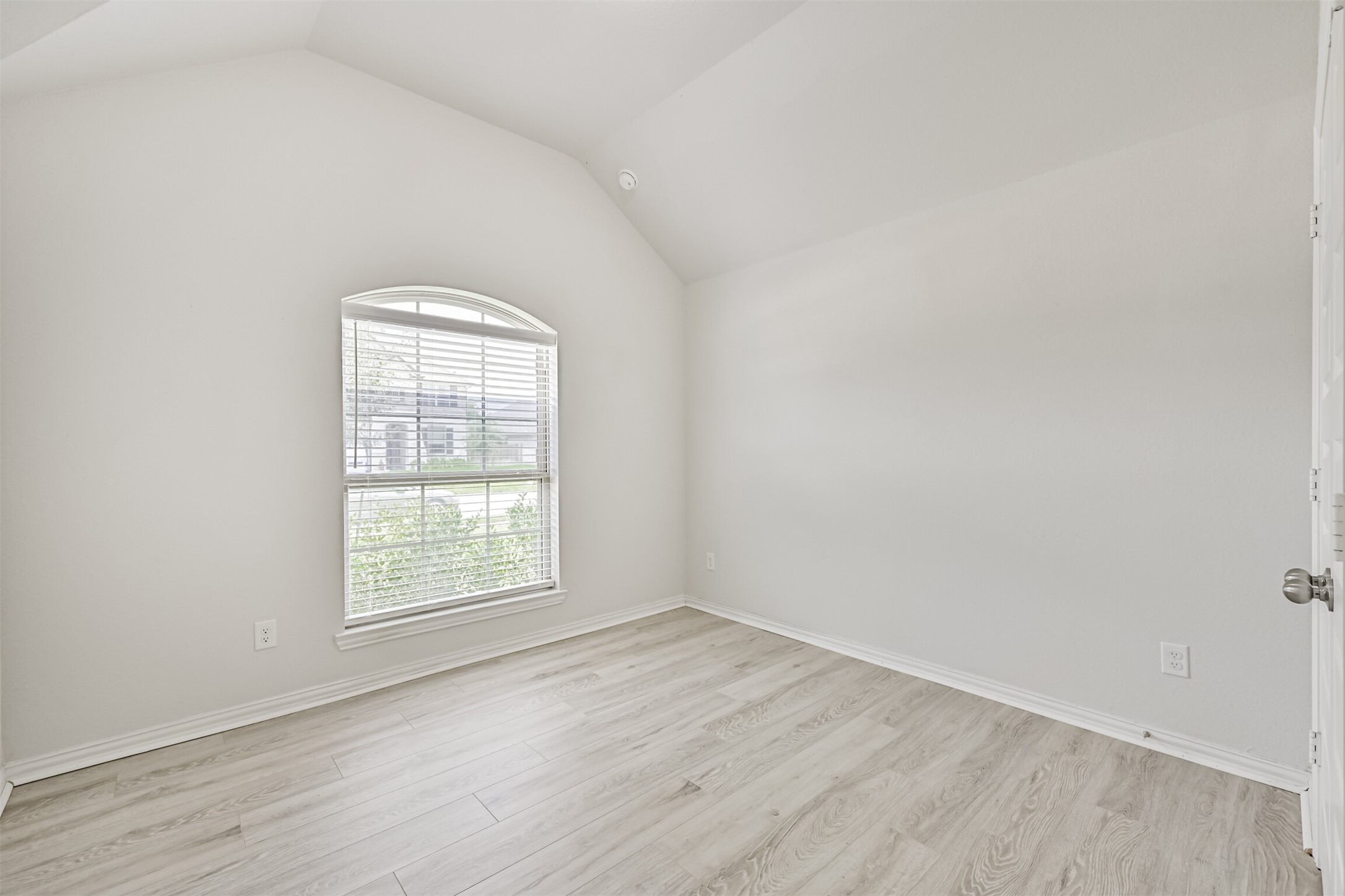 7019 Terra Drive Manvel, TX 77578 - Photo 10 of 41 an empty room with wooden floor and windows