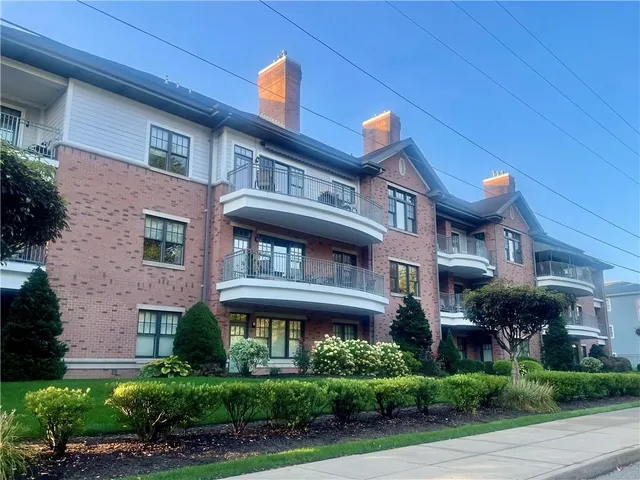 a front view of a building with garden