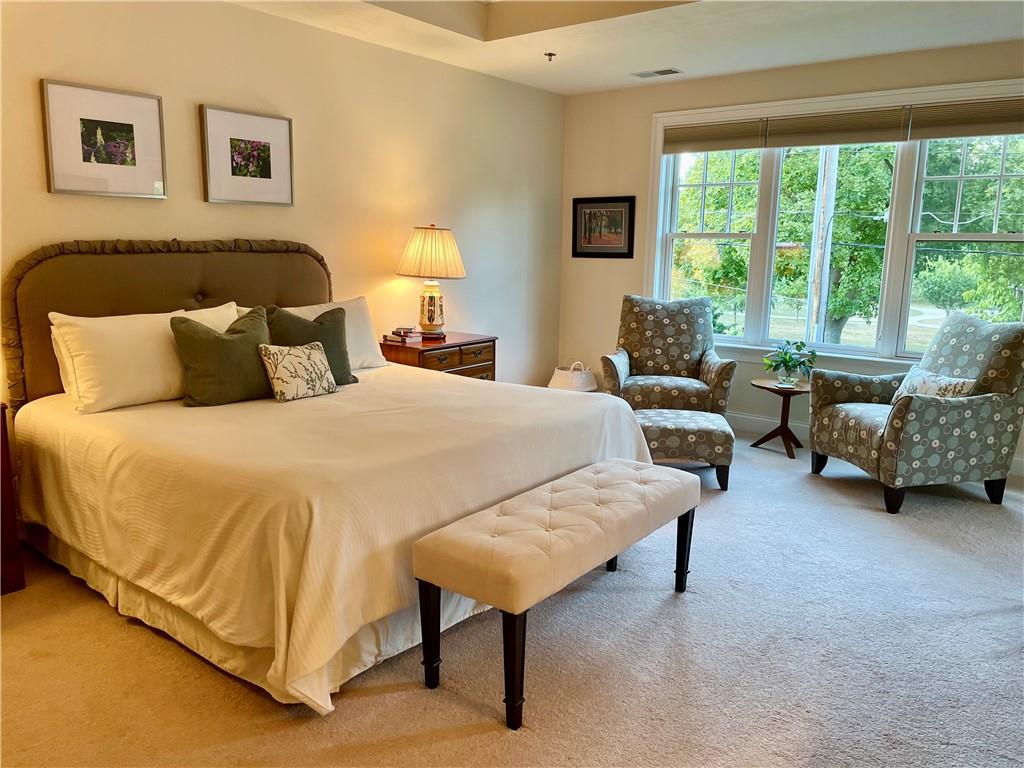 295 Market Street, Unit 123 Beaver, PA 15009 - Photo 14 of 27 a spacious bedroom with a bed and a couch