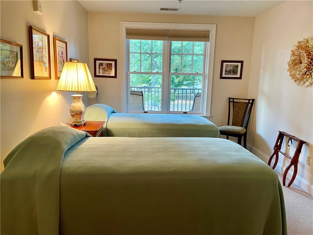 295 Market Street, Unit 123 Beaver, PA 15009 - Photo 18 of 27 a bedroom with a bed and a window