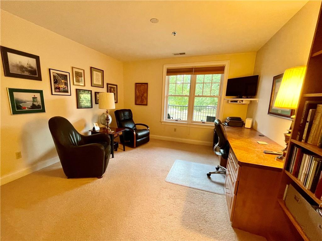 295 Market Street, Unit 123 Beaver, PA 15009 - Photo 19 of 27 a living room with furniture and a flat screen tv
