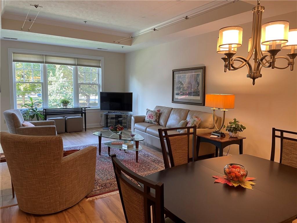 295 Market Street, Unit 123 Beaver, PA 15009 - Photo 25 of 27 a living room with furniture a flat screen tv and a window