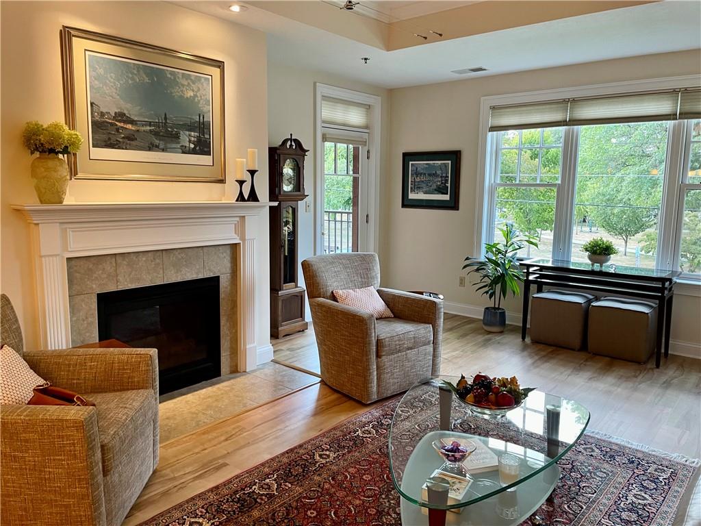 295 Market Street, Unit 123 Beaver, PA 15009 - Photo 6 of 27 a living room with furniture and a fireplace