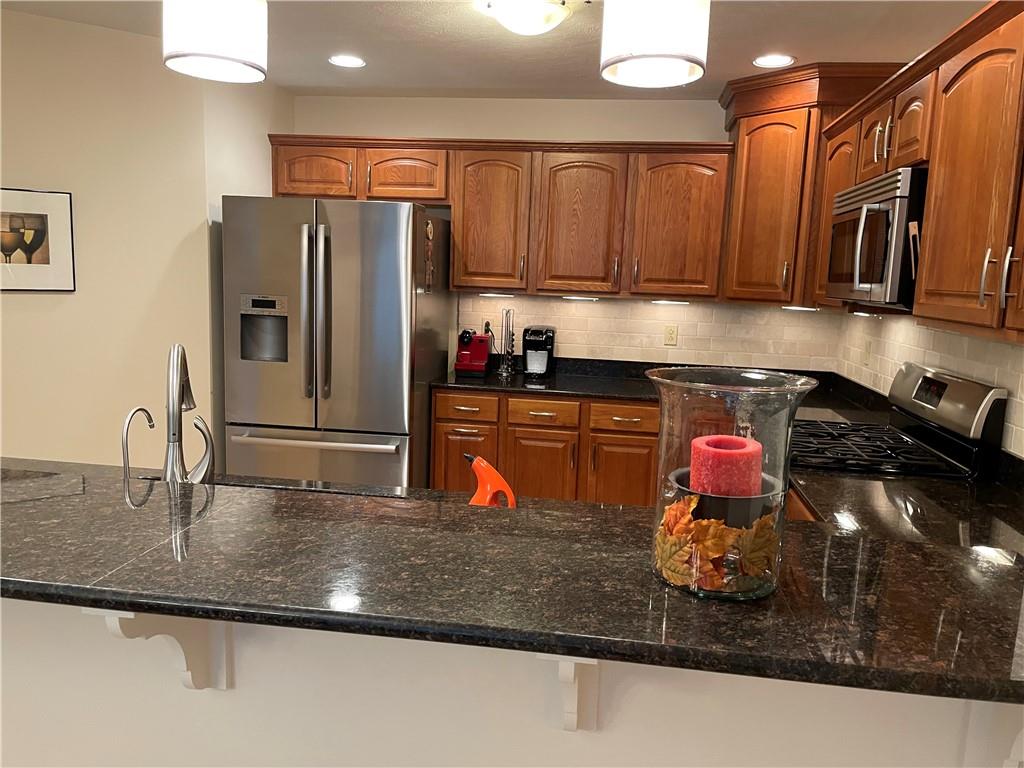 295 Market Street, Unit 123 Beaver, PA 15009 - Photo 10 of 27 a kitchen with stainless steel appliances granite countertop a sink refrigerator and cabinets