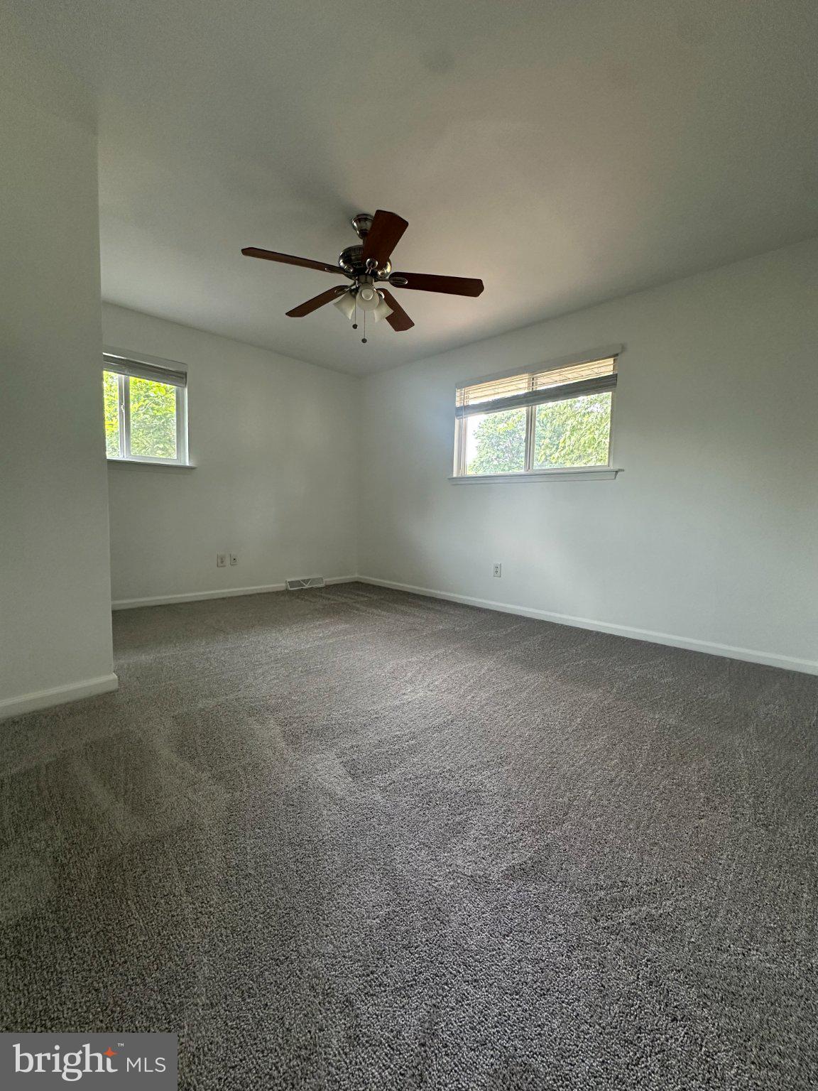 6 Travertine Way Newark, DE 19702 - Photo 22 of 22 an empty room with a window and a ceiling fan