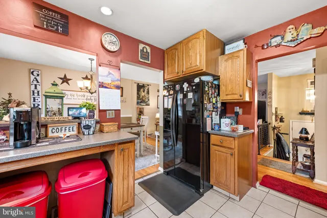 a kitchen with stainless steel appliances granite countertop a refrigerator and a stove