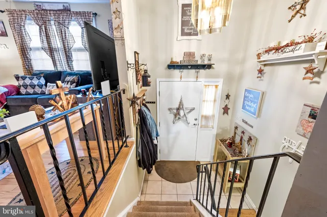 a view of living room with furniture and a fireplace