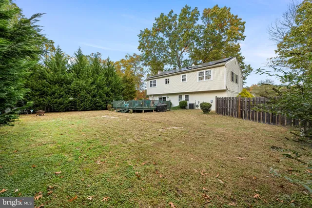 a view of a deck with table and chairs and wooden floor