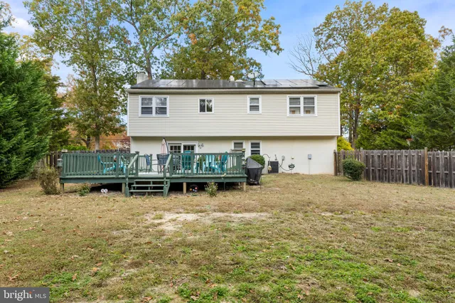 a view of a chairs and table on the deck