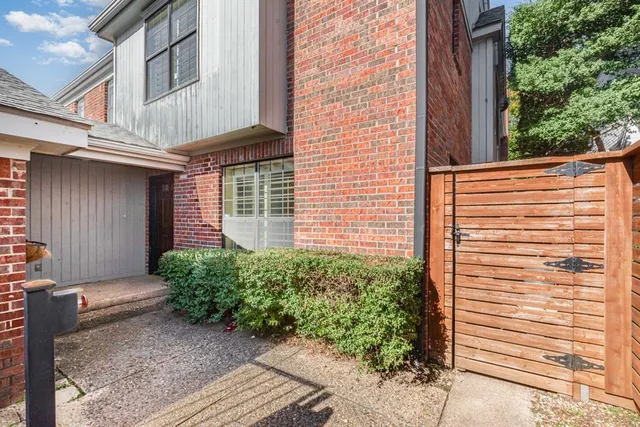 a view of a house and a yard