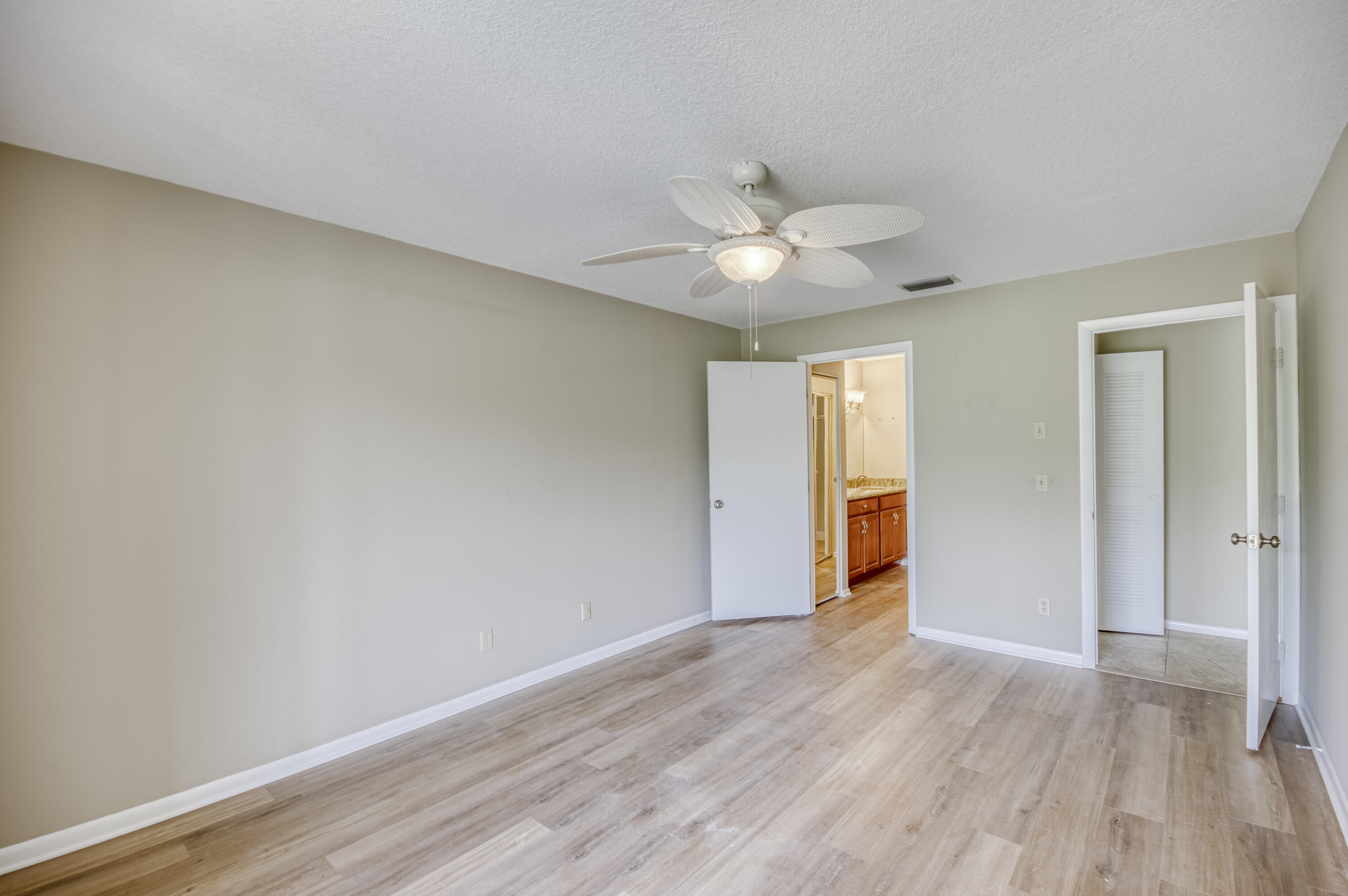 402 Pinecrest Circle, Unit D Jupiter, FL 33458 - Photo 12 of 24 Primary Bedroom