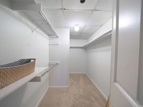 a view of a hallway with stairs