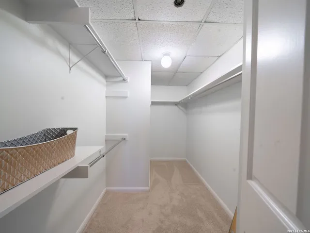 a view of a hallway with stairs