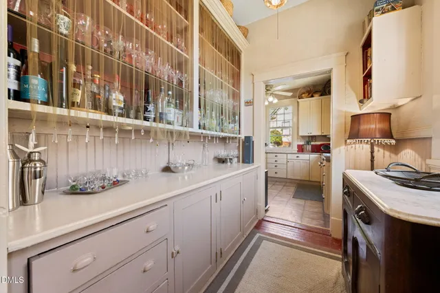 a kitchen with a sink and cabinets