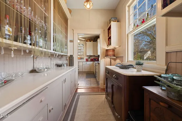 a kitchen with stainless steel appliances a sink stove and cabinets