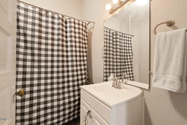 a view of a chair and tables in the balcony