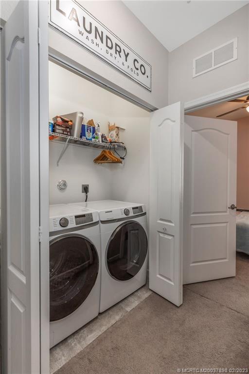 9574 Southwest Purple Martin Way Stuart, FL 34997 - Photo 22 of 32 a utility room with dryer and washer