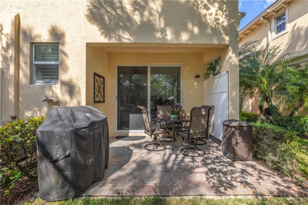 9574 Southwest Purple Martin Way Stuart, FL 34997 - Photo 25 of 32 a view of outdoor space yard and patio