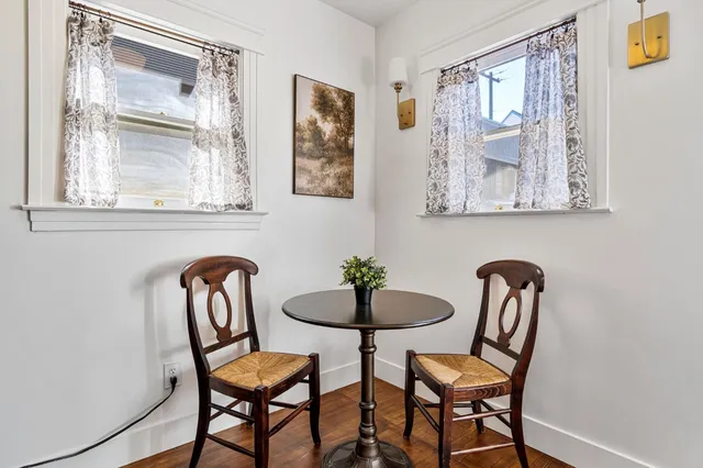a dining room with furniture and windows