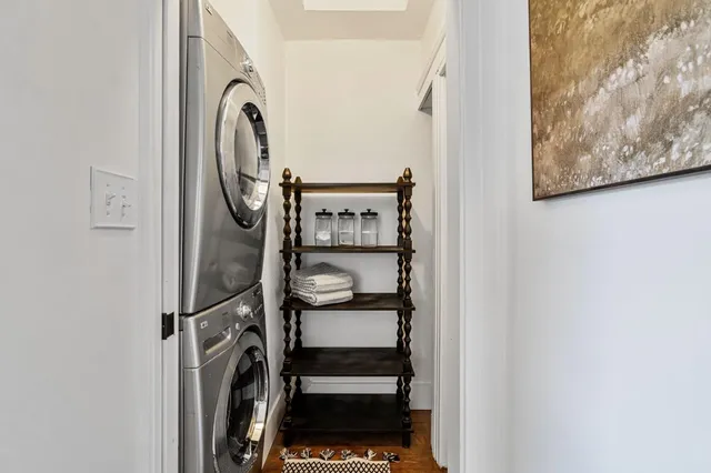 a view of a hallway with washer and dryer