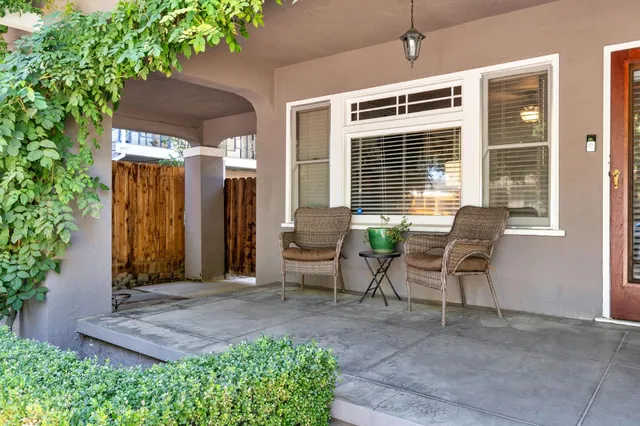 a backyard of a house with yard and outdoor seating