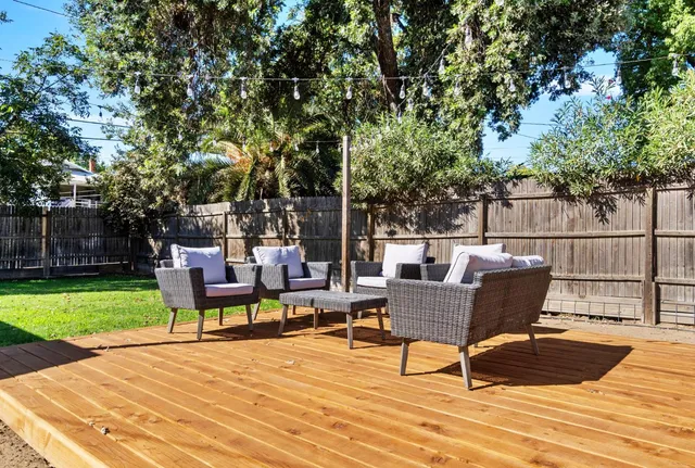 a view of a chairs and table in the patio