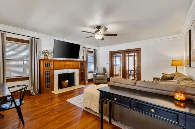 a living room with furniture fireplace and flat screen tv