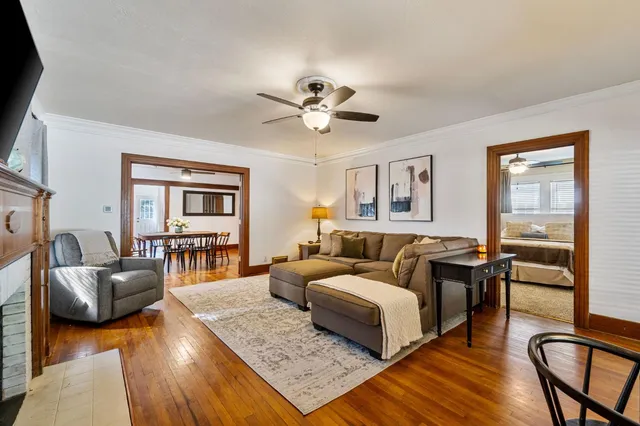 a bedroom with a bed couch and a window