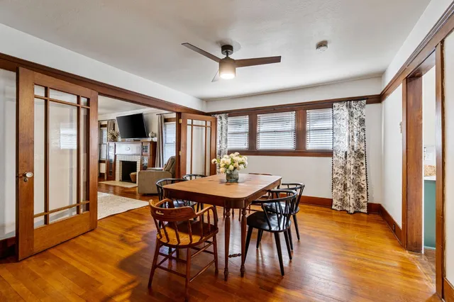 a view of a dining room with furniture window and wooden floor