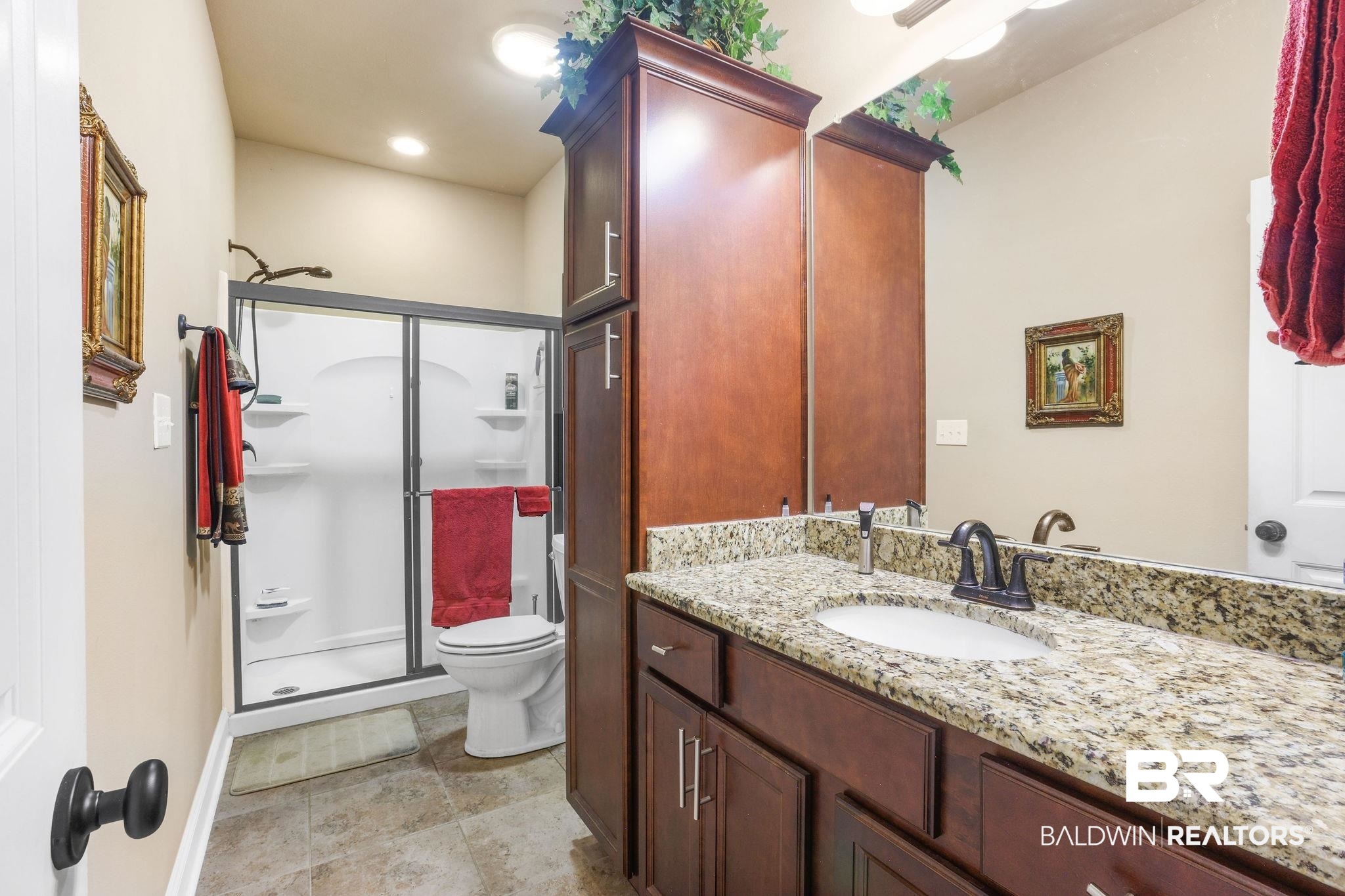 1090 Destin Avenue Foley, AL 36535 - Photo 19 of 30 Full bathroom featuring a shower stall, vanity, toilet, and baseboards