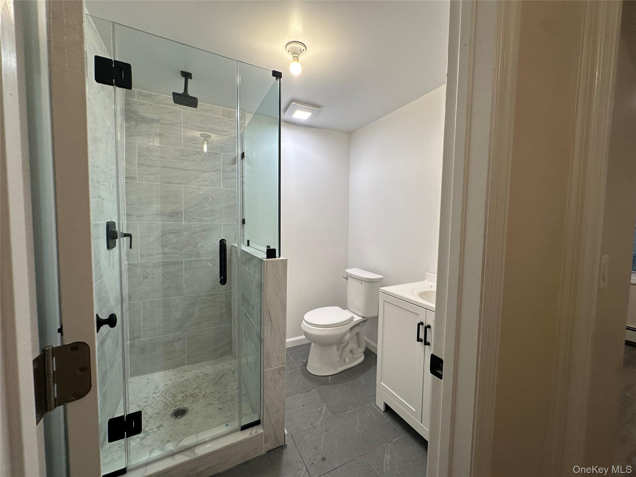 103 Sunrise Trail Wallkill, NY 12589 - Photo 14 of 24 Bathroom featuring vanity and a shower stall