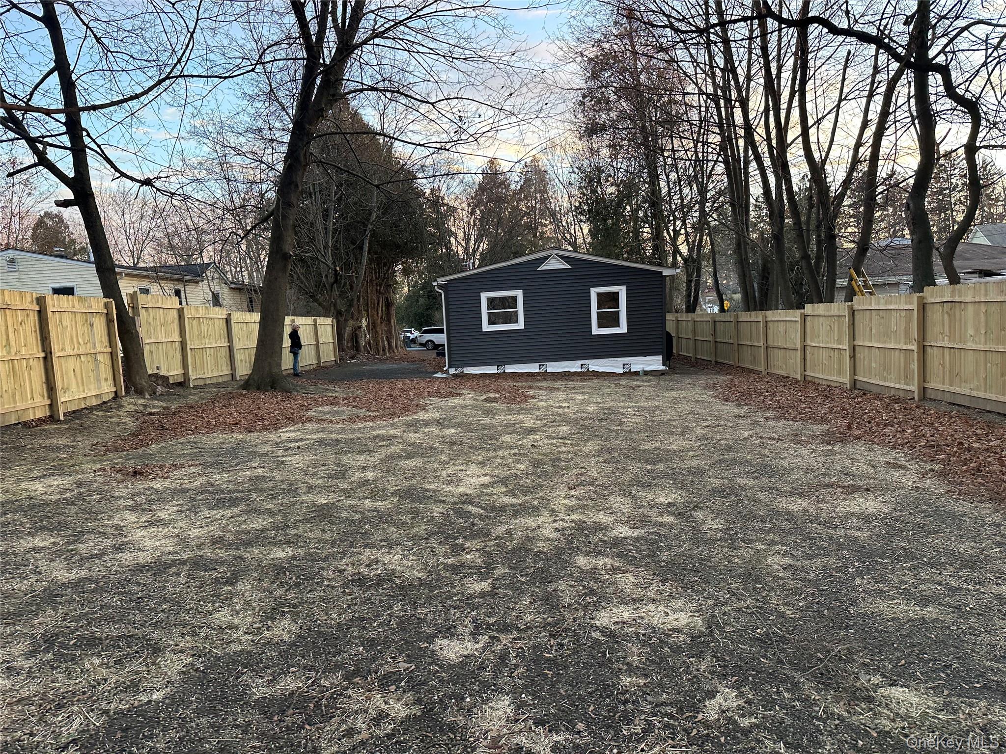 103 Sunrise Trail Wallkill, NY 12589 - Photo 8 of 24 Fenced backyard with an outbuilding