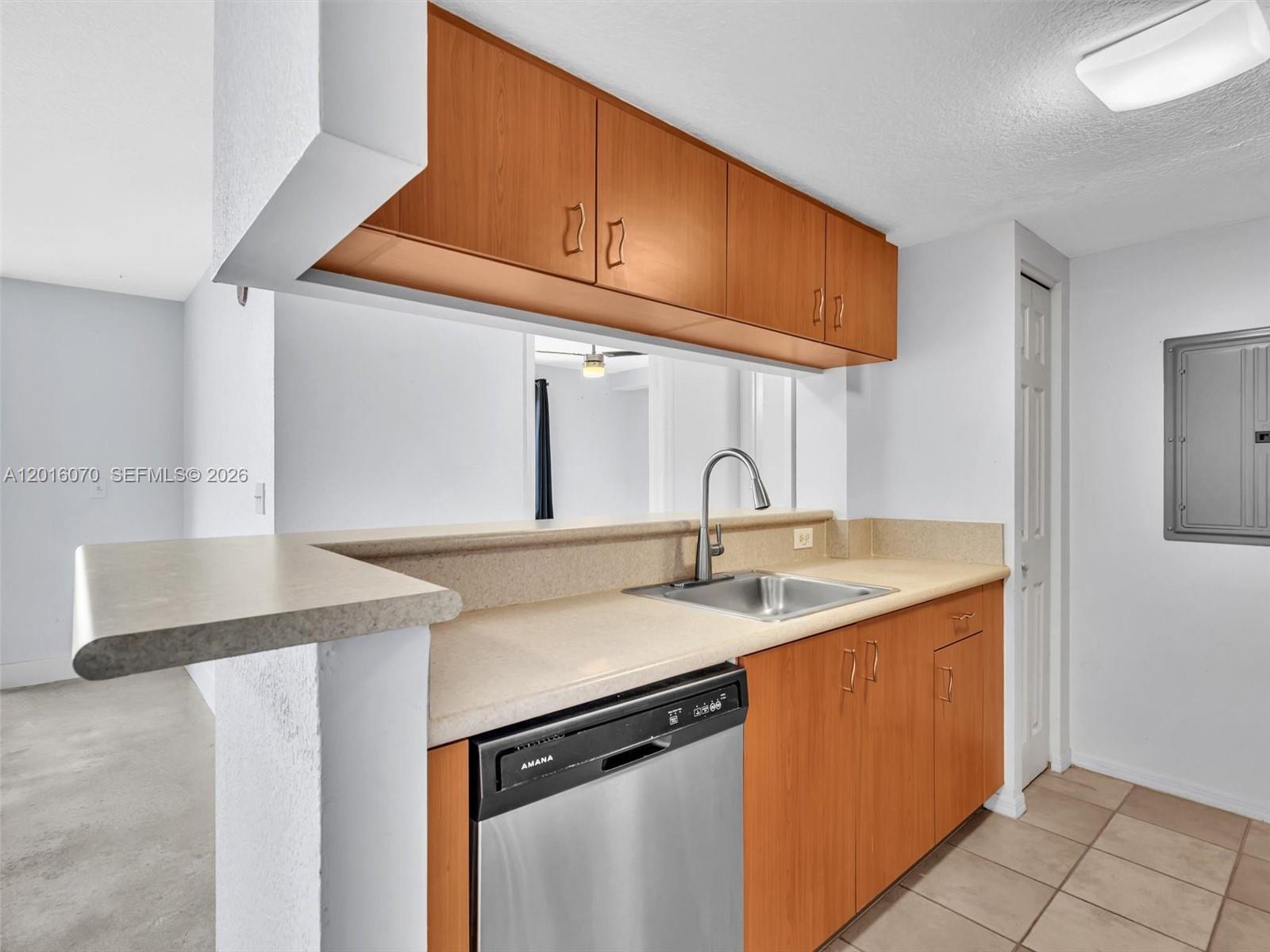 816 Northwest 11th Street, Unit 1208 Miami, FL 33136 - Photo 13 of 49 a kitchen with stainless steel appliances granite countertop a sink and a cabinets