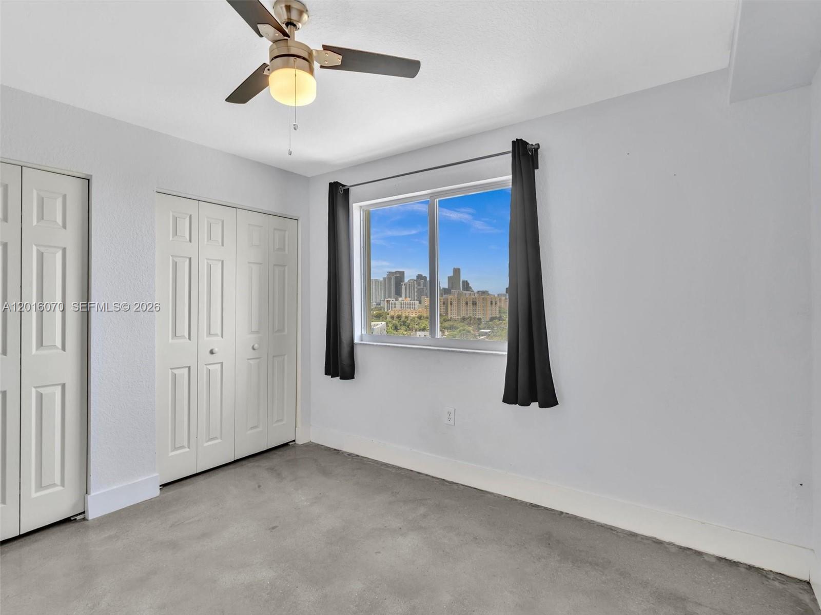 816 Northwest 11th Street, Unit 1208 Miami, FL 33136 - Photo 26 of 49 a view of an empty room with a window