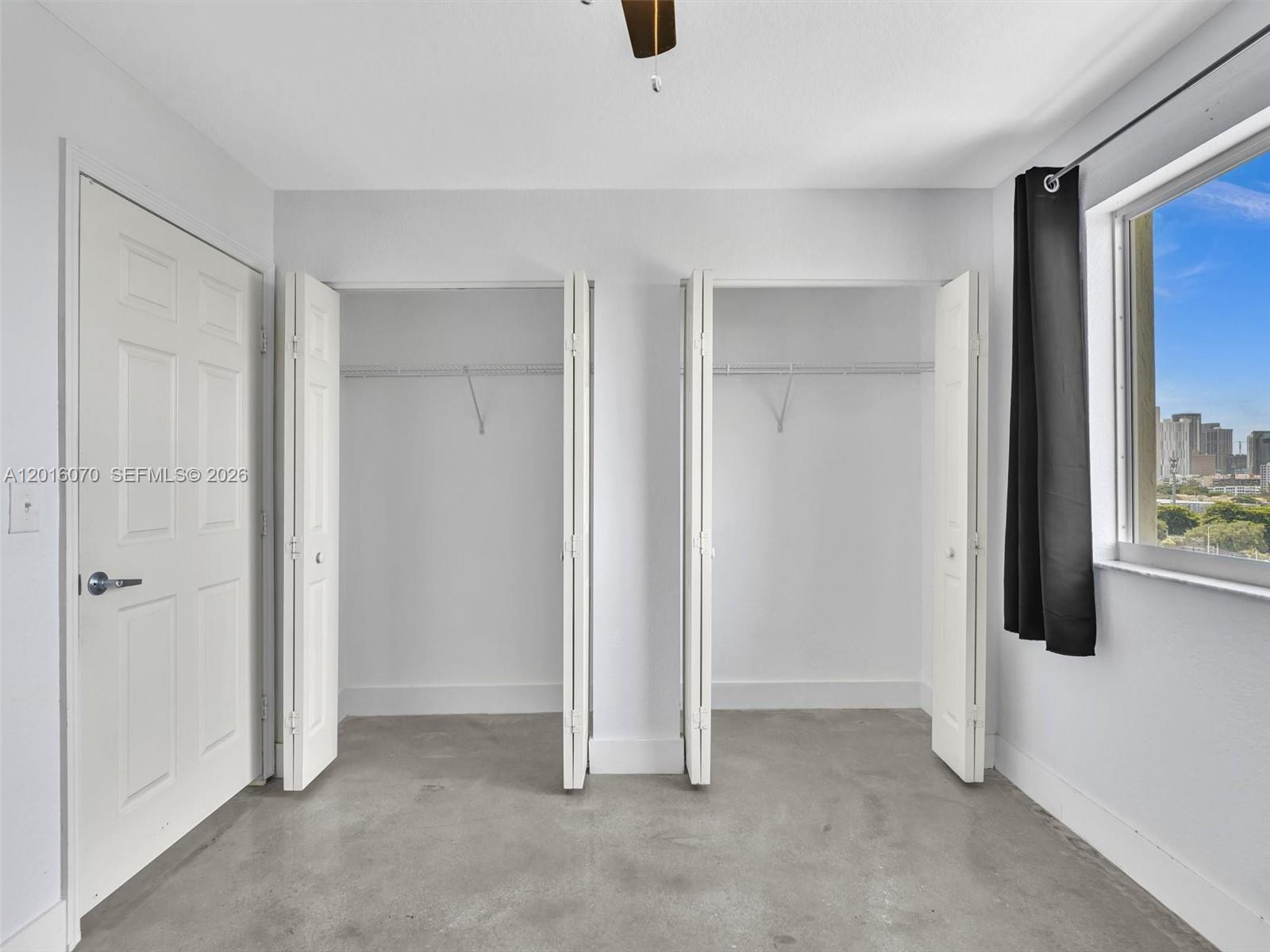 816 Northwest 11th Street, Unit 1208 Miami, FL 33136 - Photo 28 of 49 an empty room with windows
