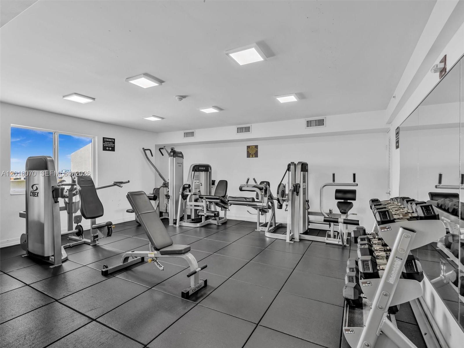 816 Northwest 11th Street, Unit 1208 Miami, FL 33136 - Photo 39 of 49 a view of a room with gym equipment