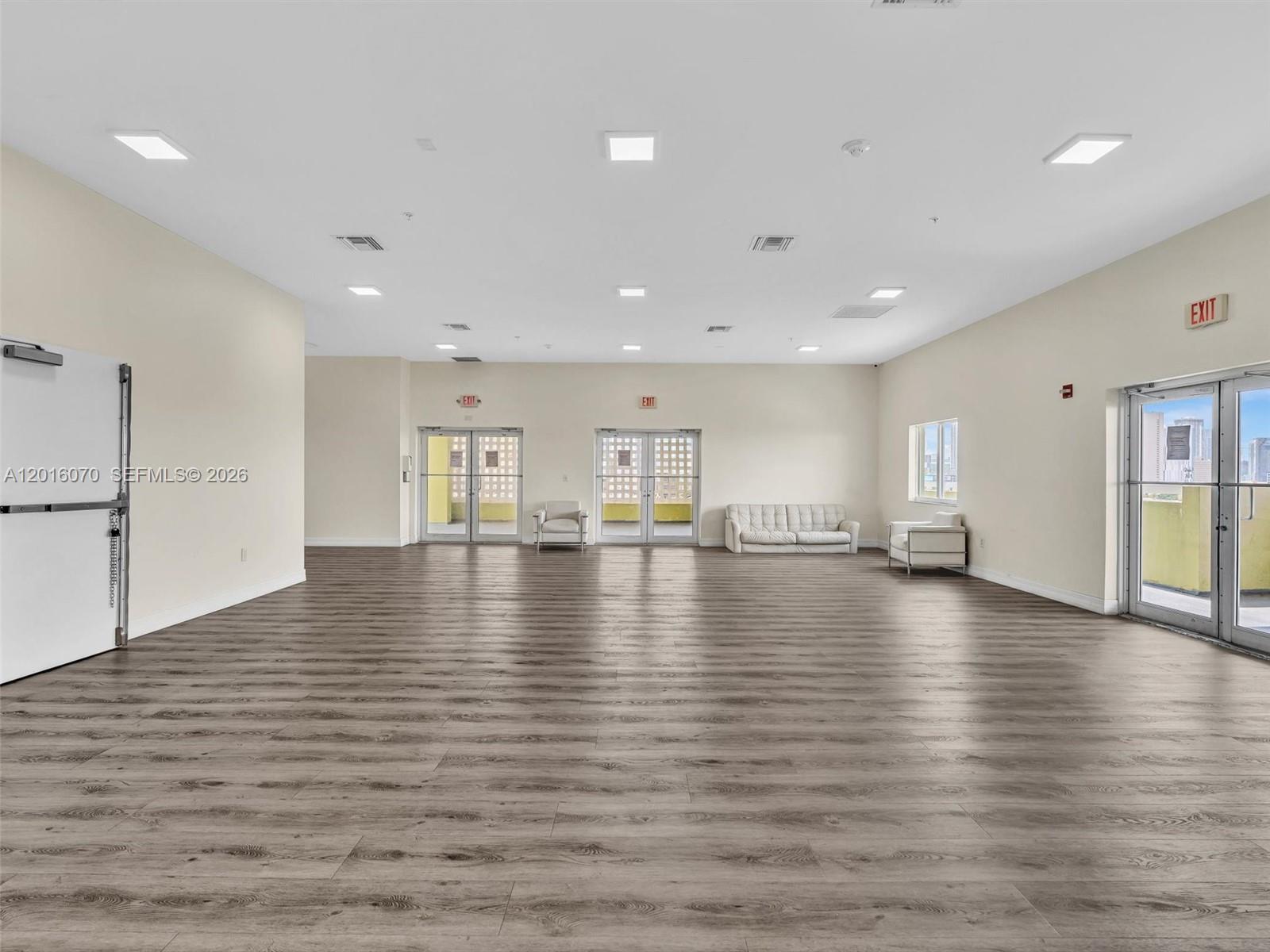 816 Northwest 11th Street, Unit 1208 Miami, FL 33136 - Photo 40 of 49 a view of empty room with wooden floor
