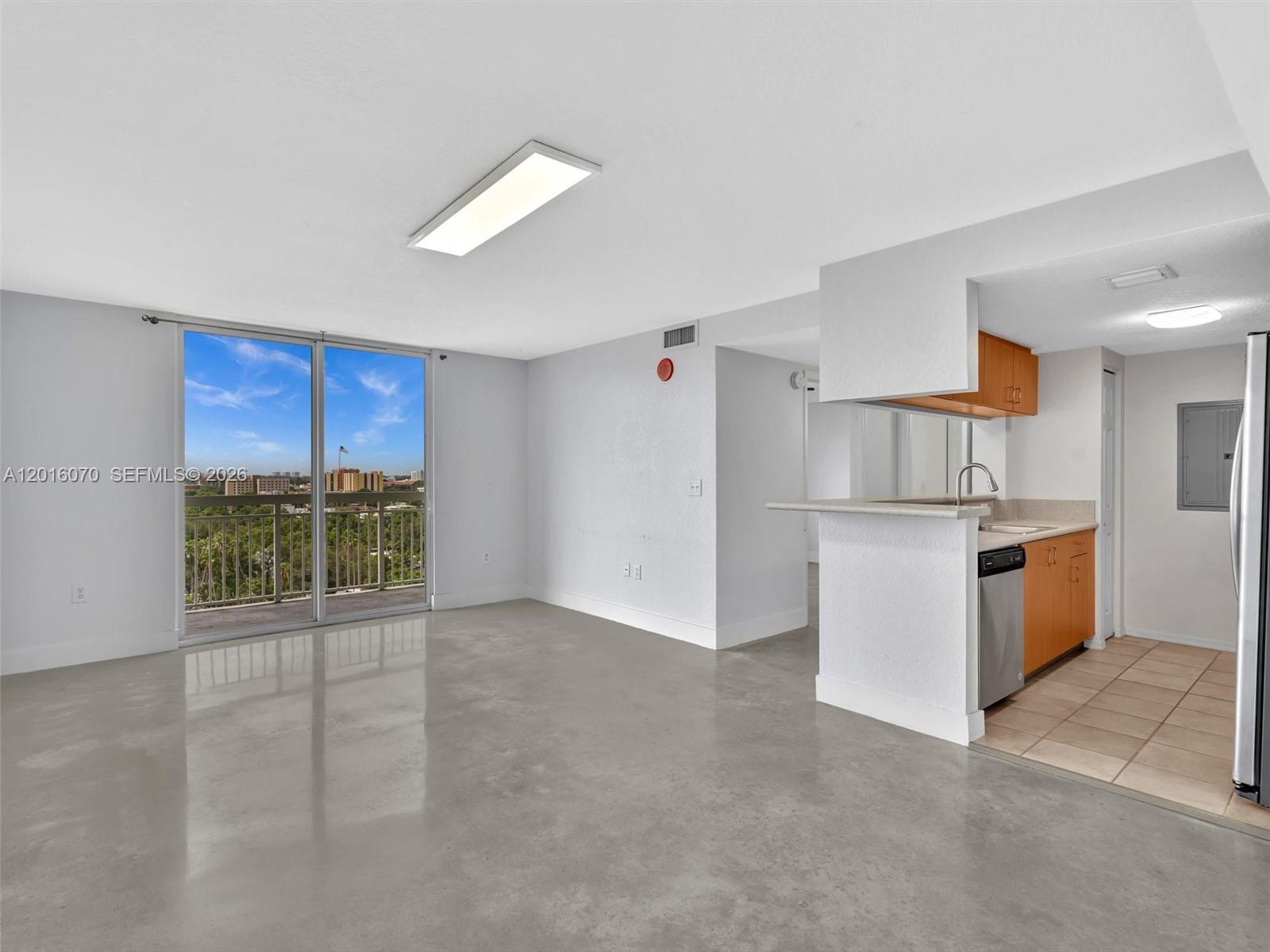 816 Northwest 11th Street, Unit 1208 Miami, FL 33136 - Photo 7 of 49 a view of kitchen with refrigerator and window